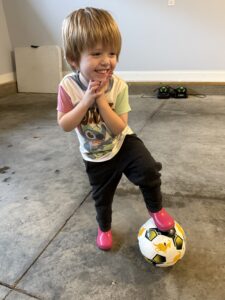 girl trapping soccer ball